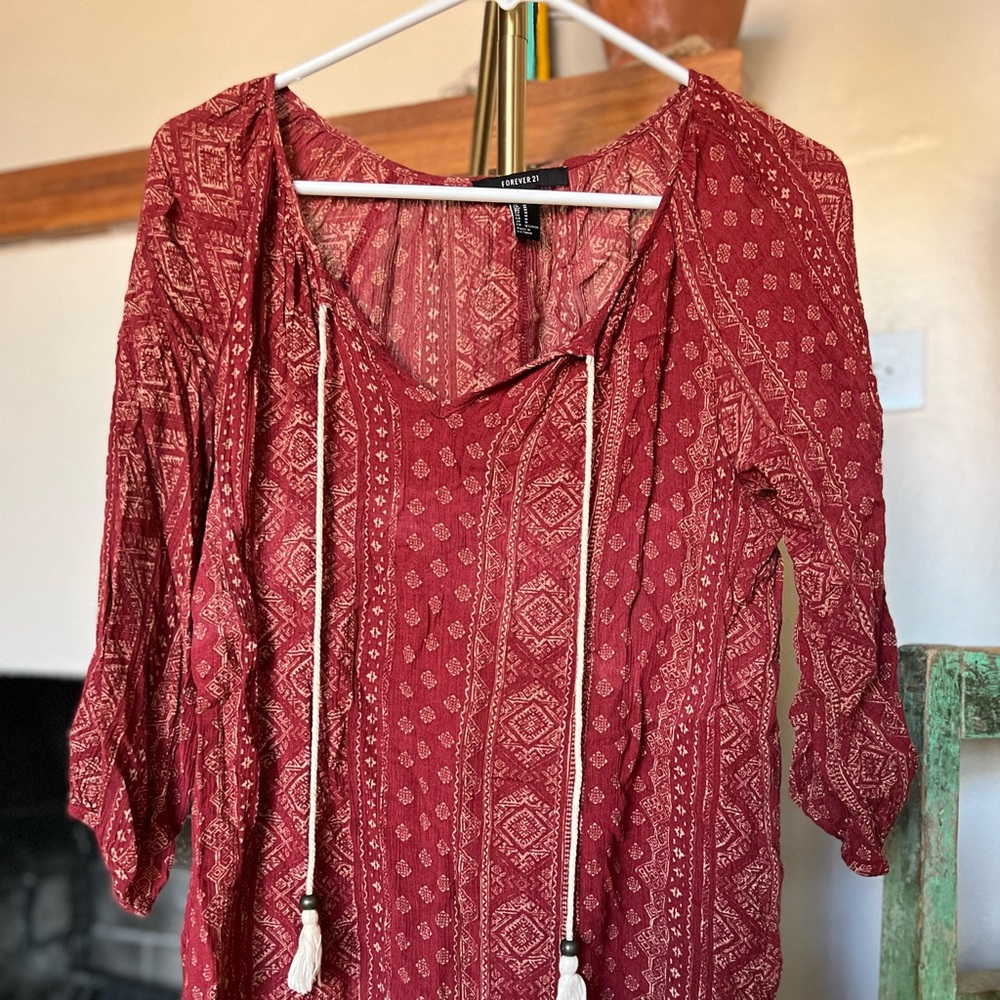 Red printed boho top with collar tie.